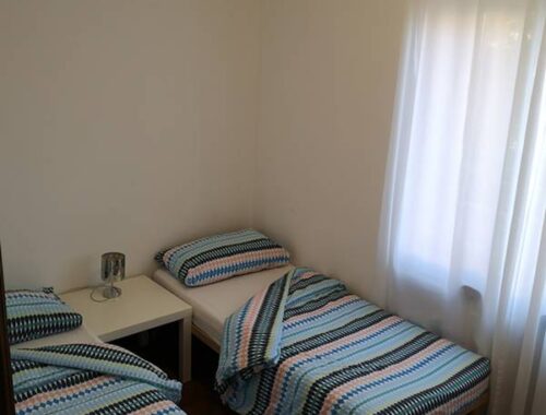 "alt="bedroom two single beds